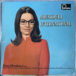 NANA MOUSKOURI - MOUSKOURI INTERNATIONAL PLAK